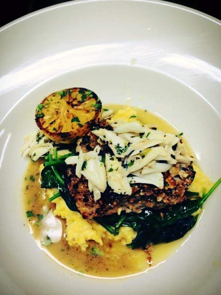 Blackened fish over polenta with jumbo lump crab — Southern coastal signature