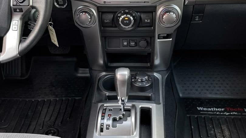 2021 Toyota 4Runner SR5 center console — automatic shifter, HVAC controls, WeatherTech floor mat