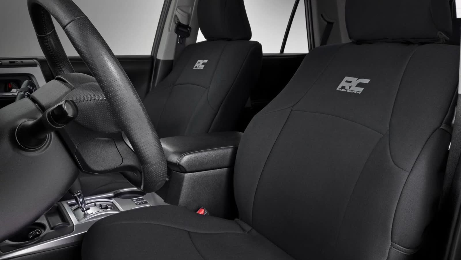White 2021 Toyota 4Runner SR5 interior — Rough Country front seat covers, steering wheel, center console