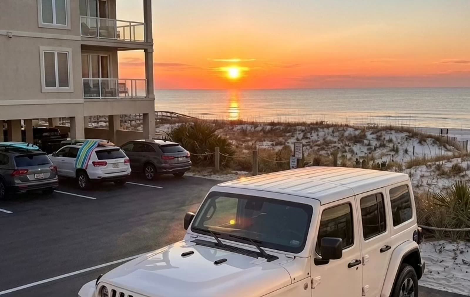 Jeep Wrangler Sahara at sunset on the Gulf Shores beach road