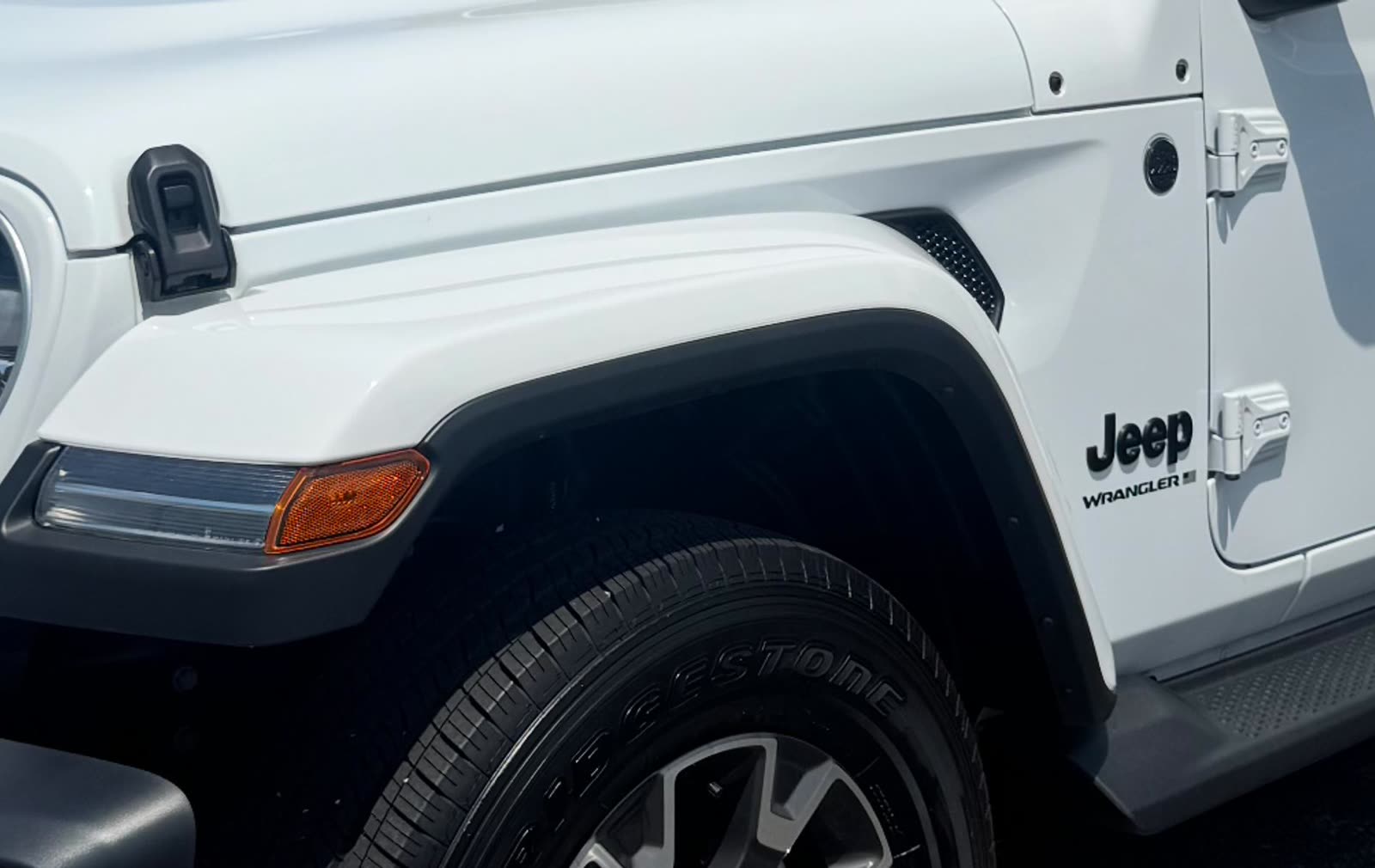 White Jeep Wrangler Sahara side profile