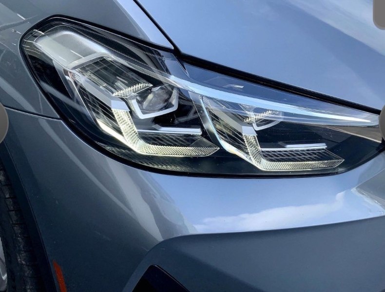 BMW X3 LED headlight detail — gray exterior paint